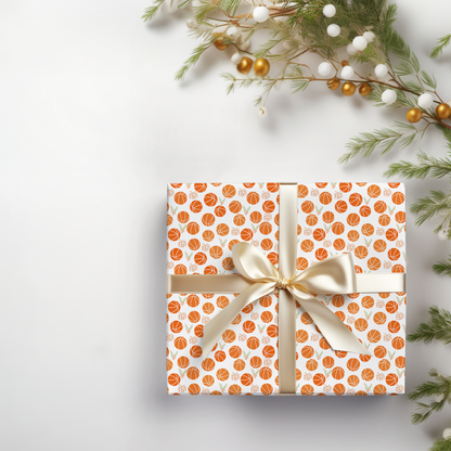 a present wrapped in orange and white paper with a bow
