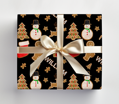 a present wrapped in a black wrapping paper with snowmen and christmas trees