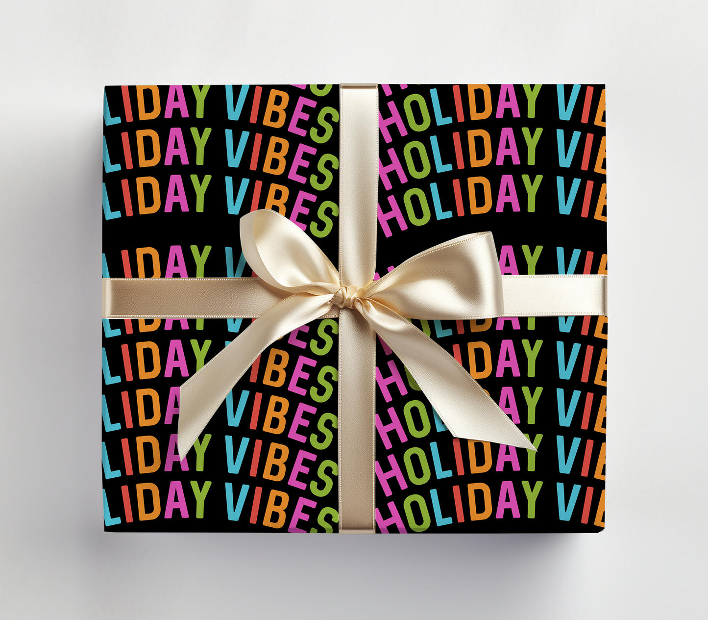 a black box with a white ribbon and a white bow