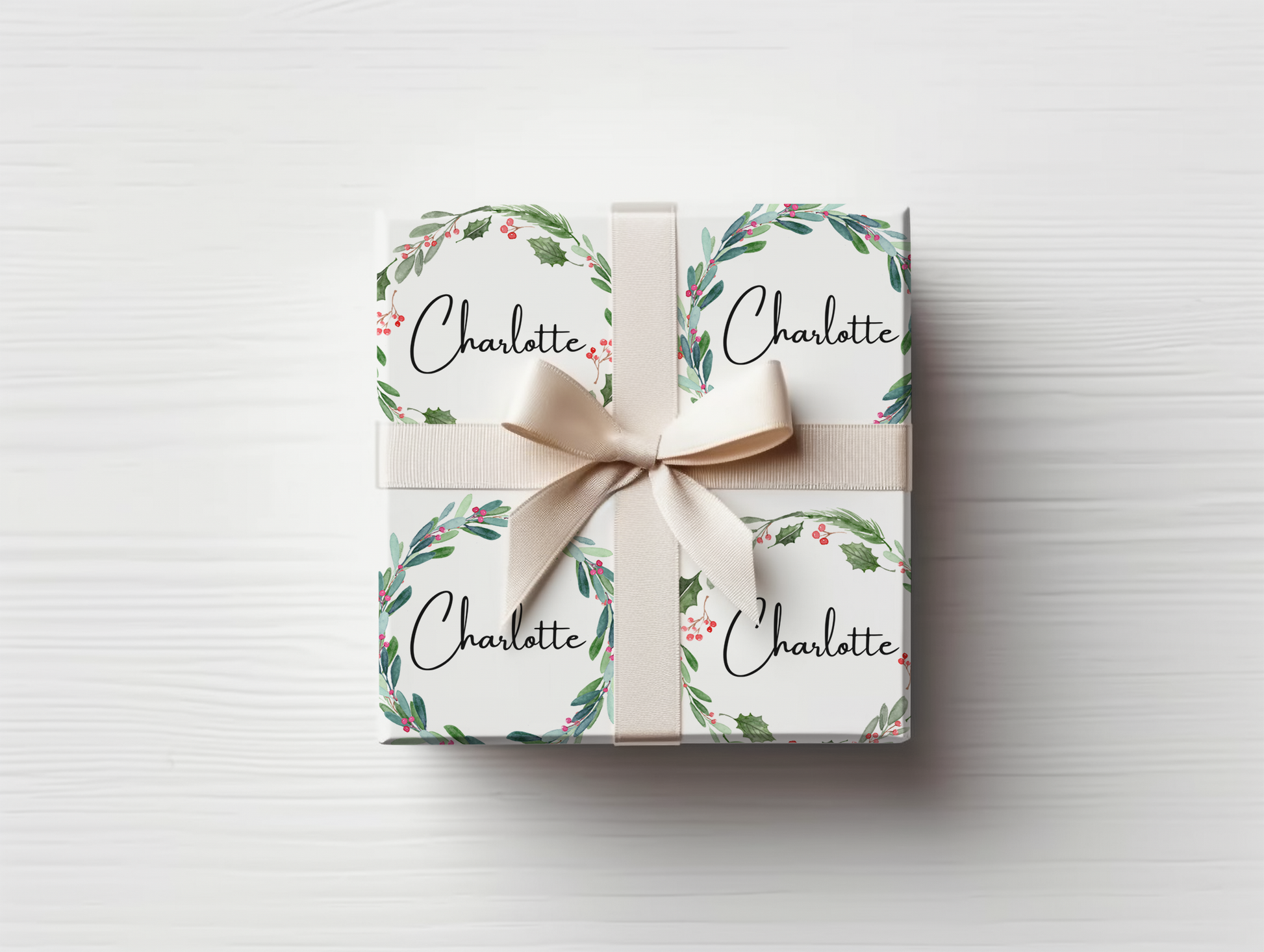 a gift wrapped in white paper with a bow