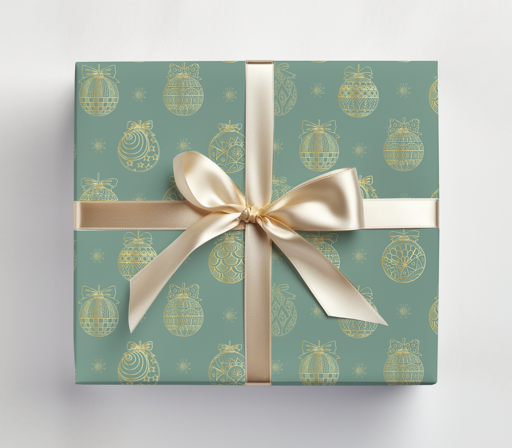 a present wrapped in a green wrapping paper with a gold bow