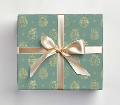 a present wrapped in a green wrapping paper with a gold bow