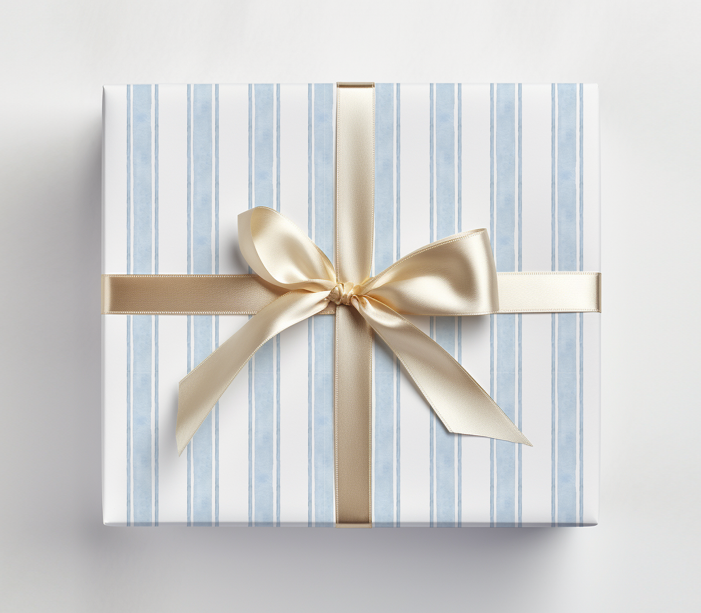a blue and white striped gift box with a gold bow