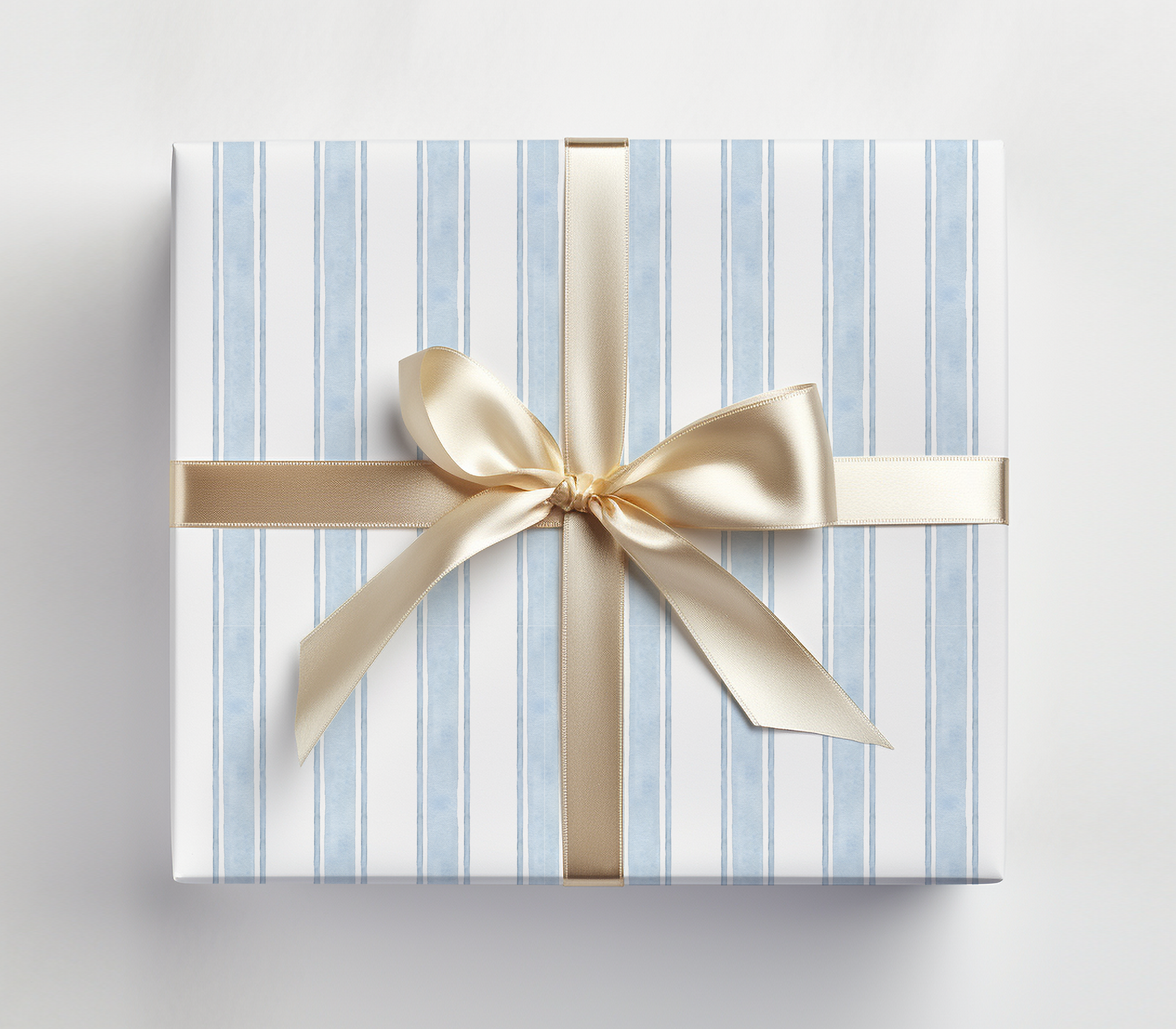 a blue and white striped gift box with a gold bow