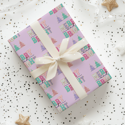 a gift wrapped in a pink wrapping paper with a white ribbon