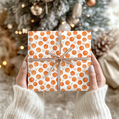 a person holding a wrapped present in front of a christmas tree