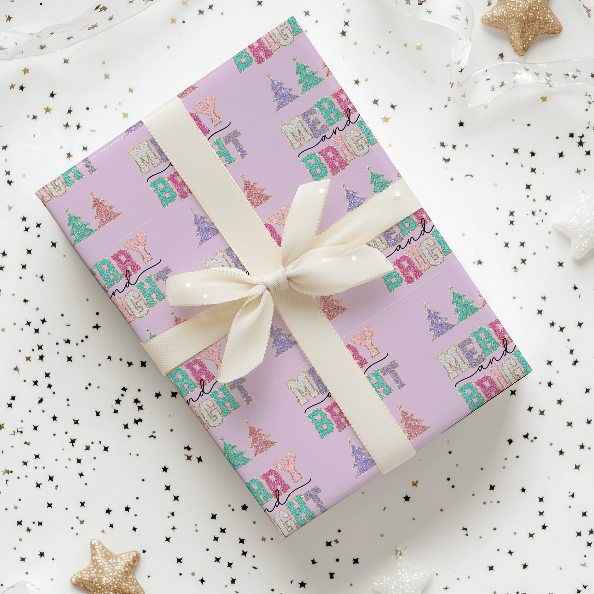 a gift wrapped in a pink wrapping paper with a white ribbon