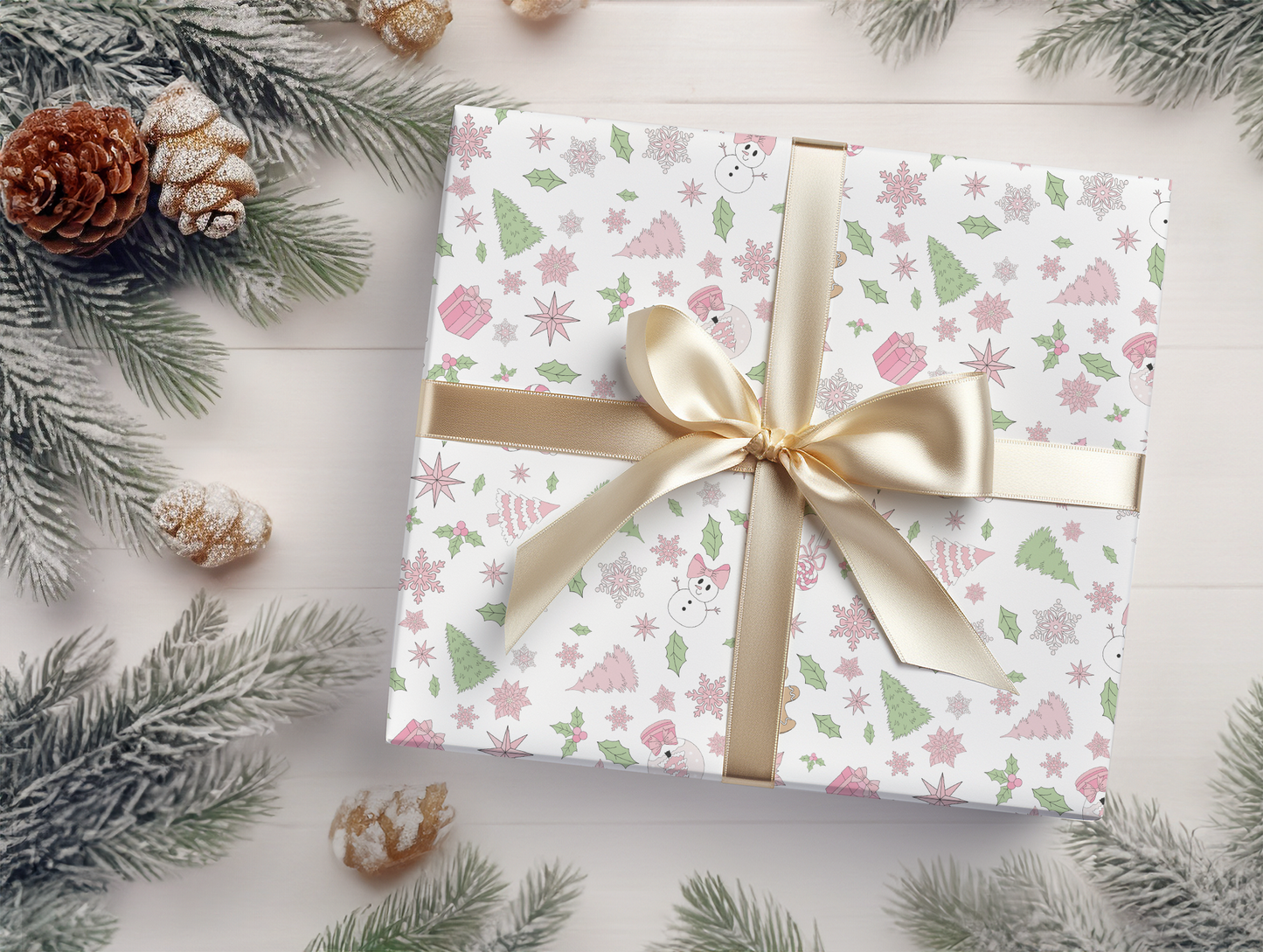 a present wrapped in white paper with a gold ribbon