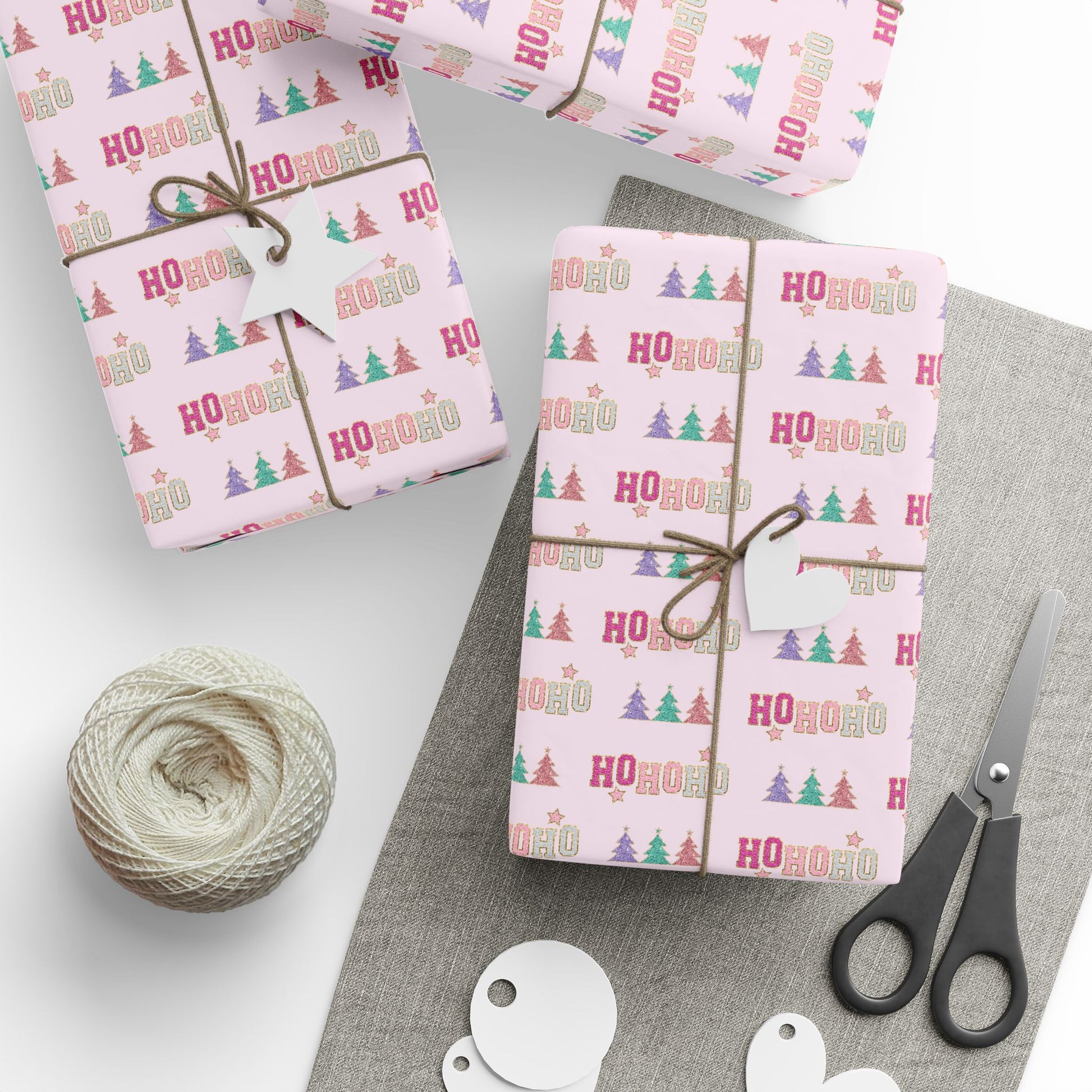 a table topped with wrapping paper and scissors