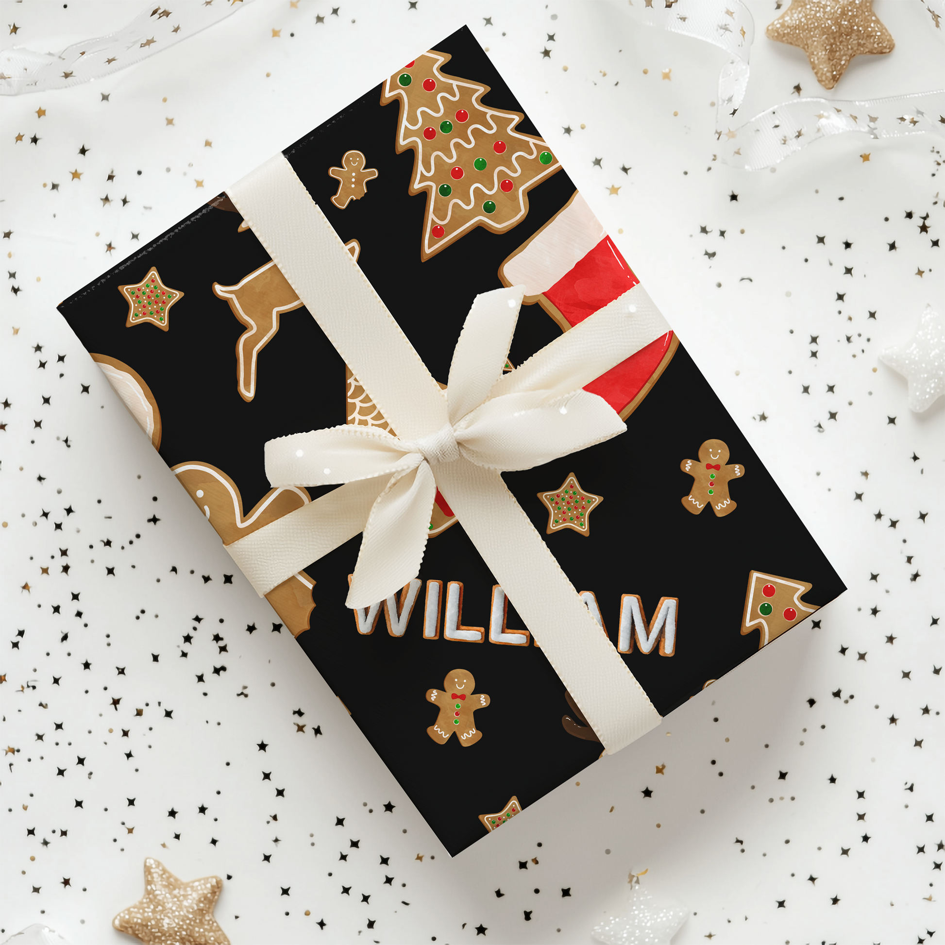 a gift wrapped in black and gold with a white ribbon