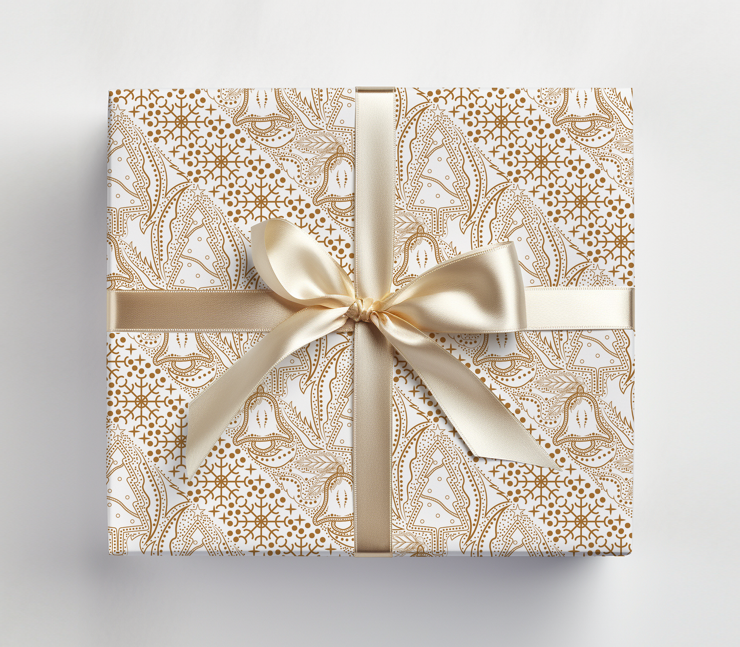 a wrapped gift box with a gold bow