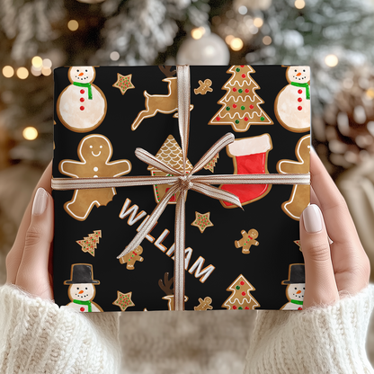 a person holding up a christmas present in front of a christmas tree
