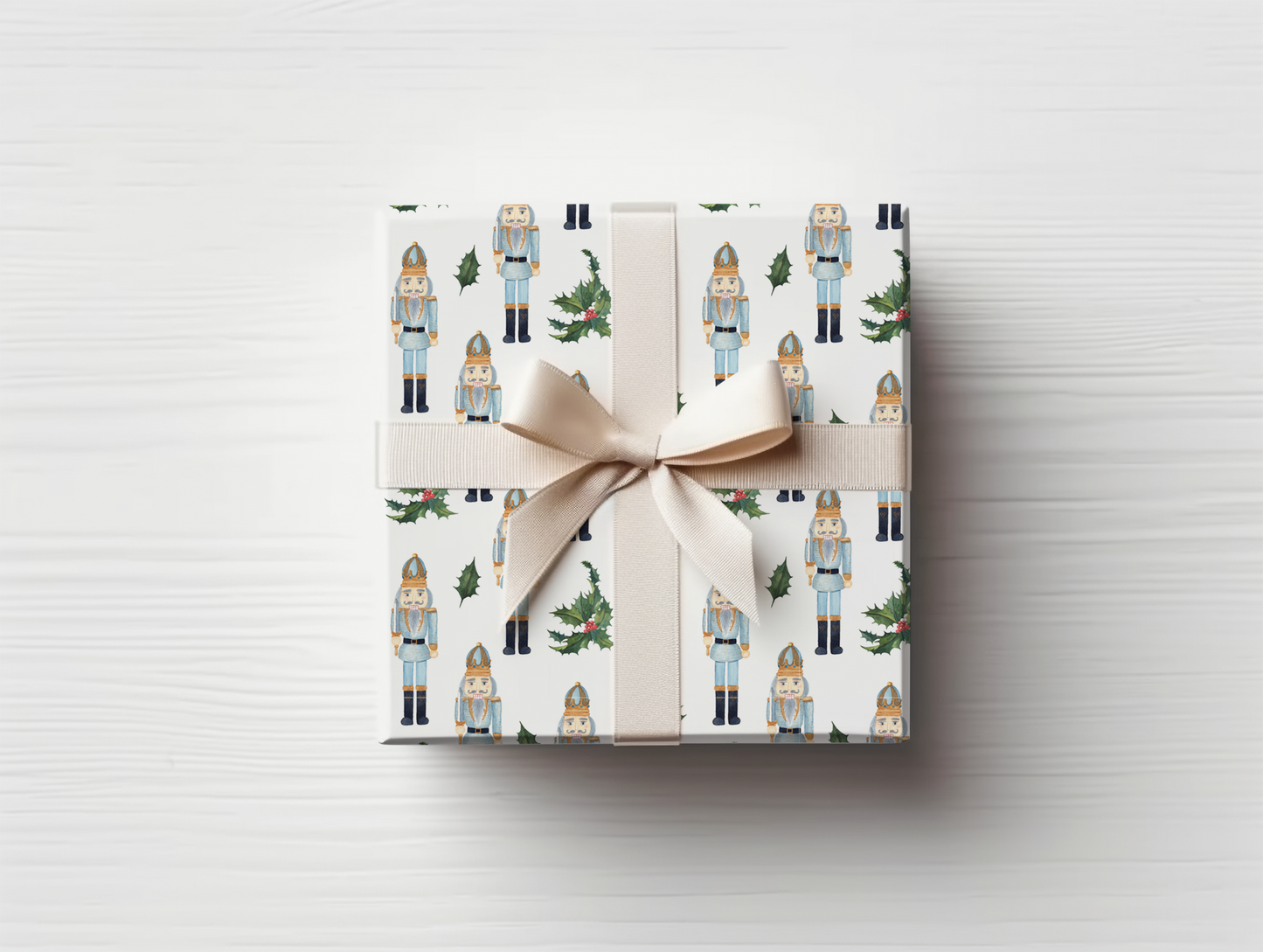 a wrapped present with a bow on a white table