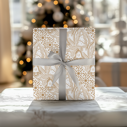 a white gift box with a silver bow on a table