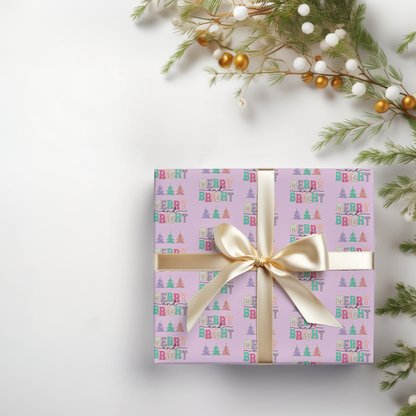 a present wrapped in a pink wrapping paper with a gold bow
