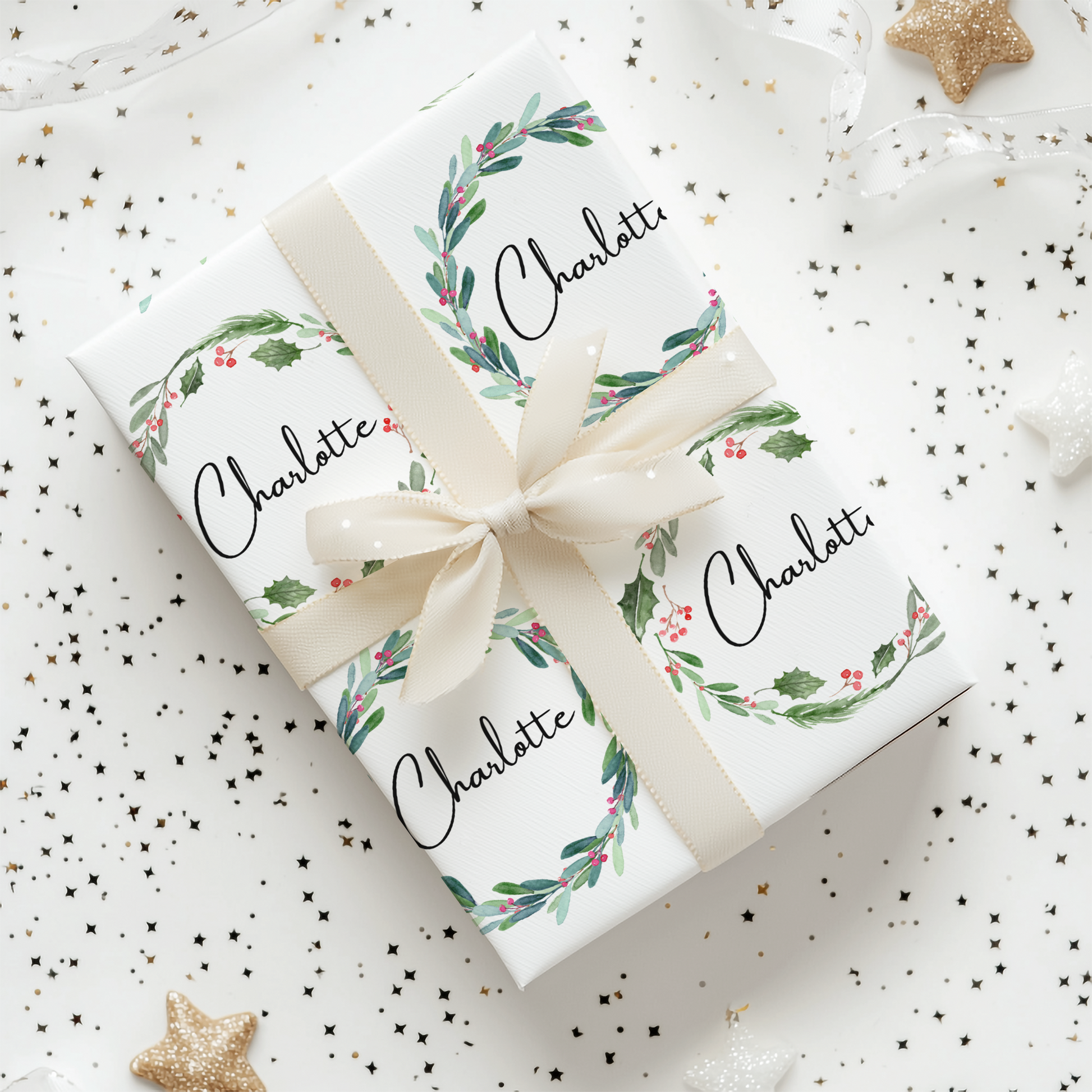 a gift wrapped in white paper with a ribbon