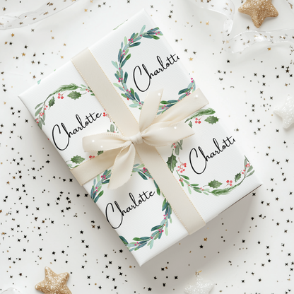 a gift wrapped in white paper with a ribbon