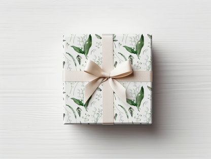 a wrapped gift box with a bow on top of it