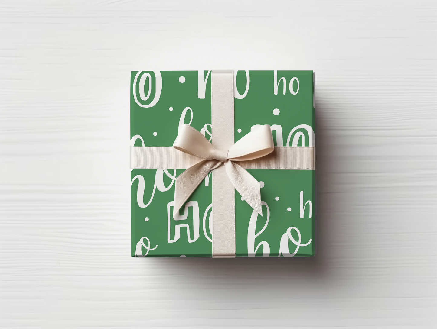 a present wrapped in a green wrapping paper with a bow