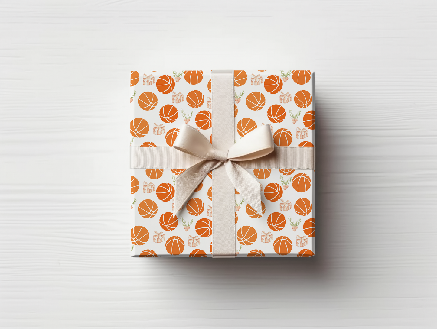 a wrapped gift with a bow and basketballs on it