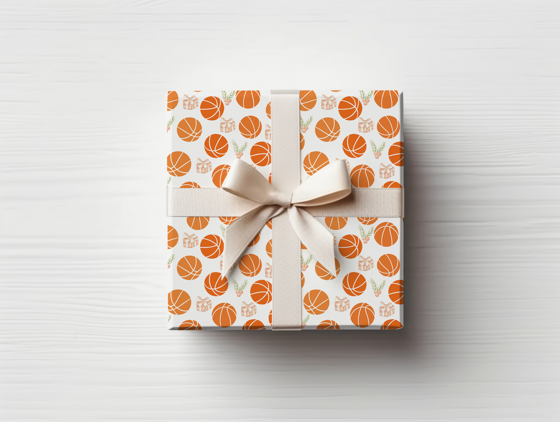 a wrapped gift with a bow and basketballs on it