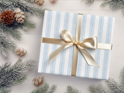 a present wrapped in a blue and white striped paper with a gold bow