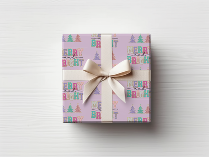 a gift wrapped in a pink wrapping paper with a bow