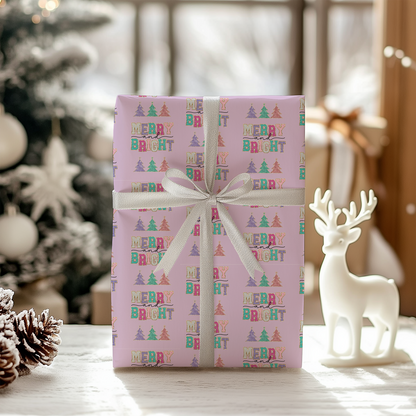 a present wrapped in pink paper with a white ribbon