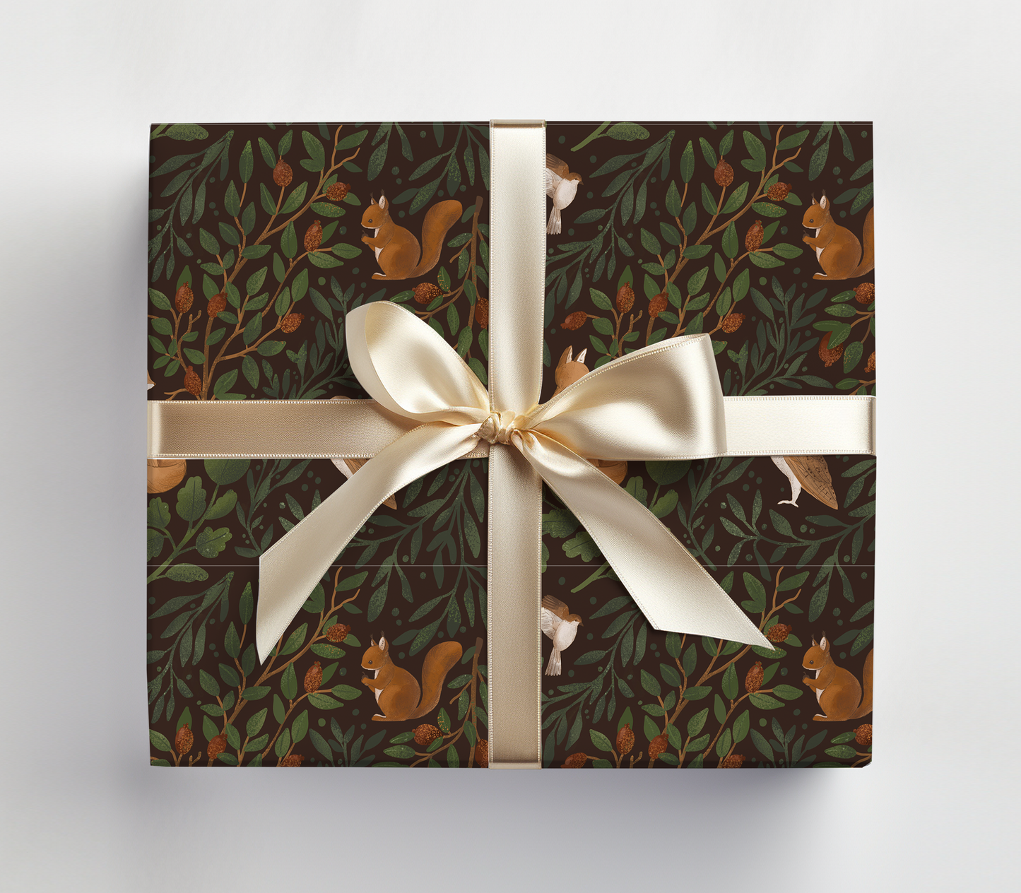 a wrapped gift box with a white ribbon