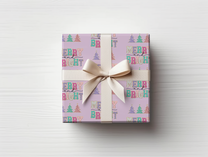 a gift wrapped in a pink wrapping paper with a bow
