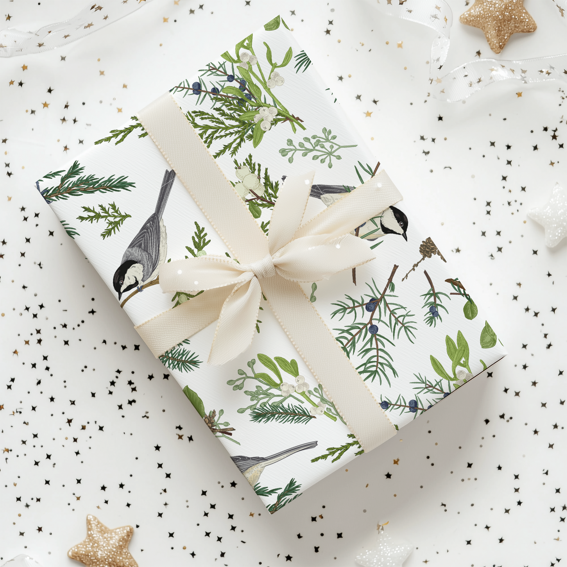 a gift wrapped in wrapping paper with a bird design