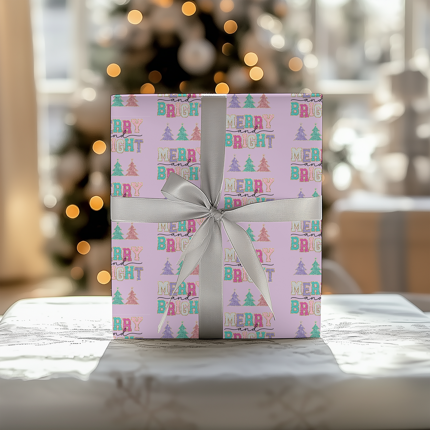 a present wrapped in pink paper with a silver bow