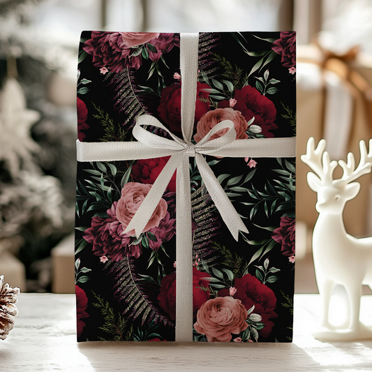 a present wrapped in a floral pattern with a white ribbon