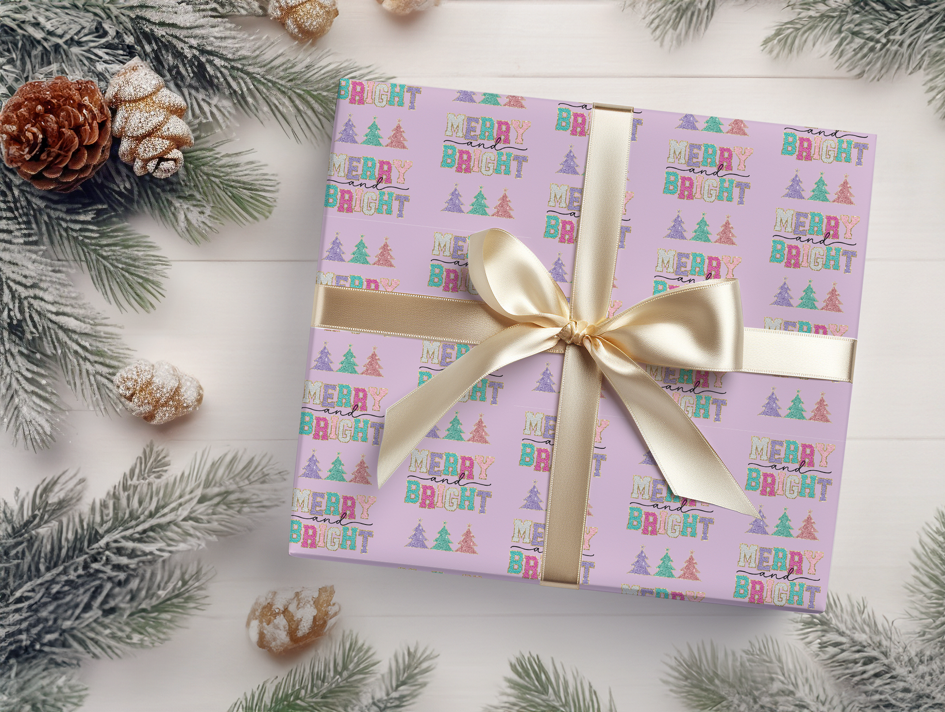 a present wrapped in a pink wrapping paper with a gold bow