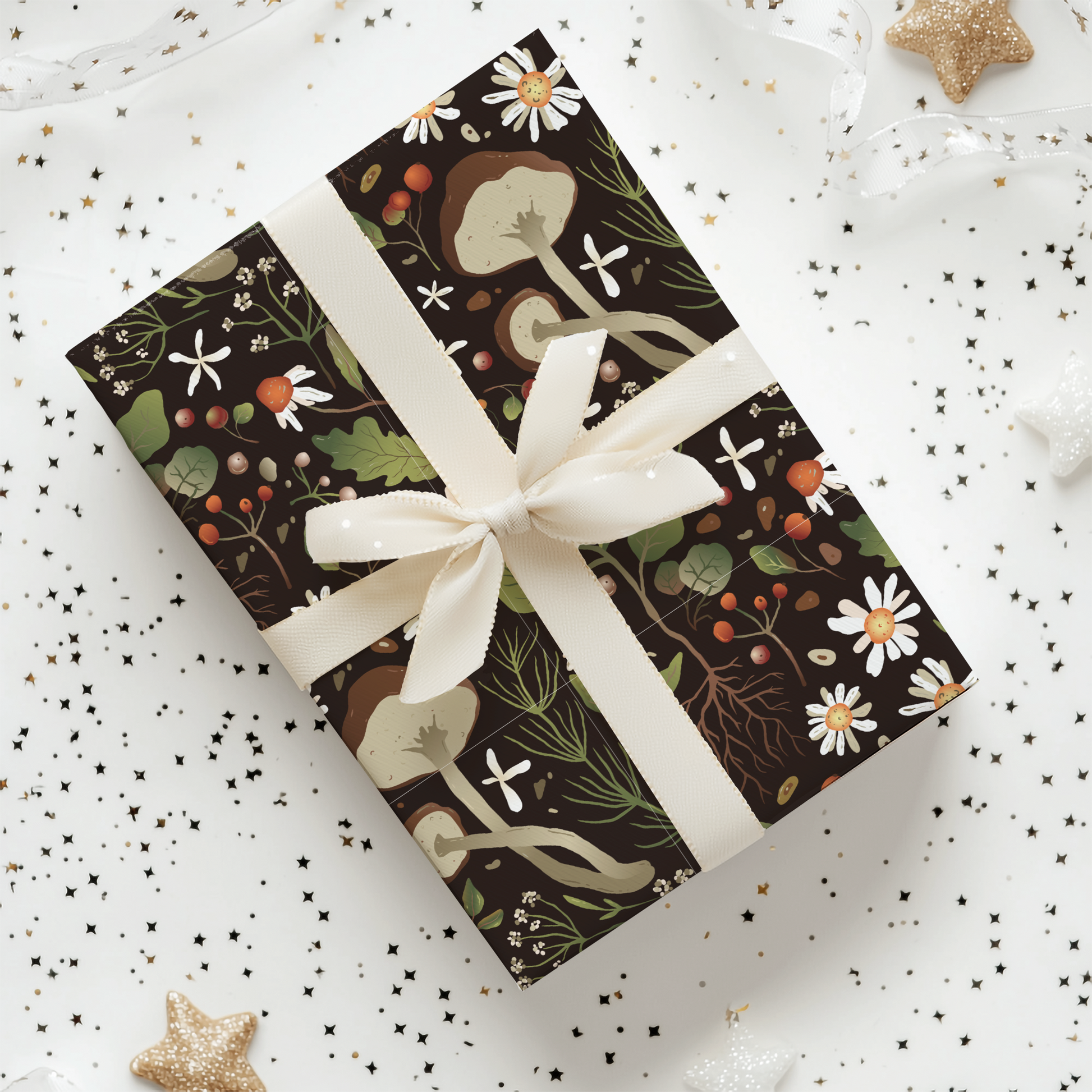 a gift wrapped in black and white paper with a white ribbon